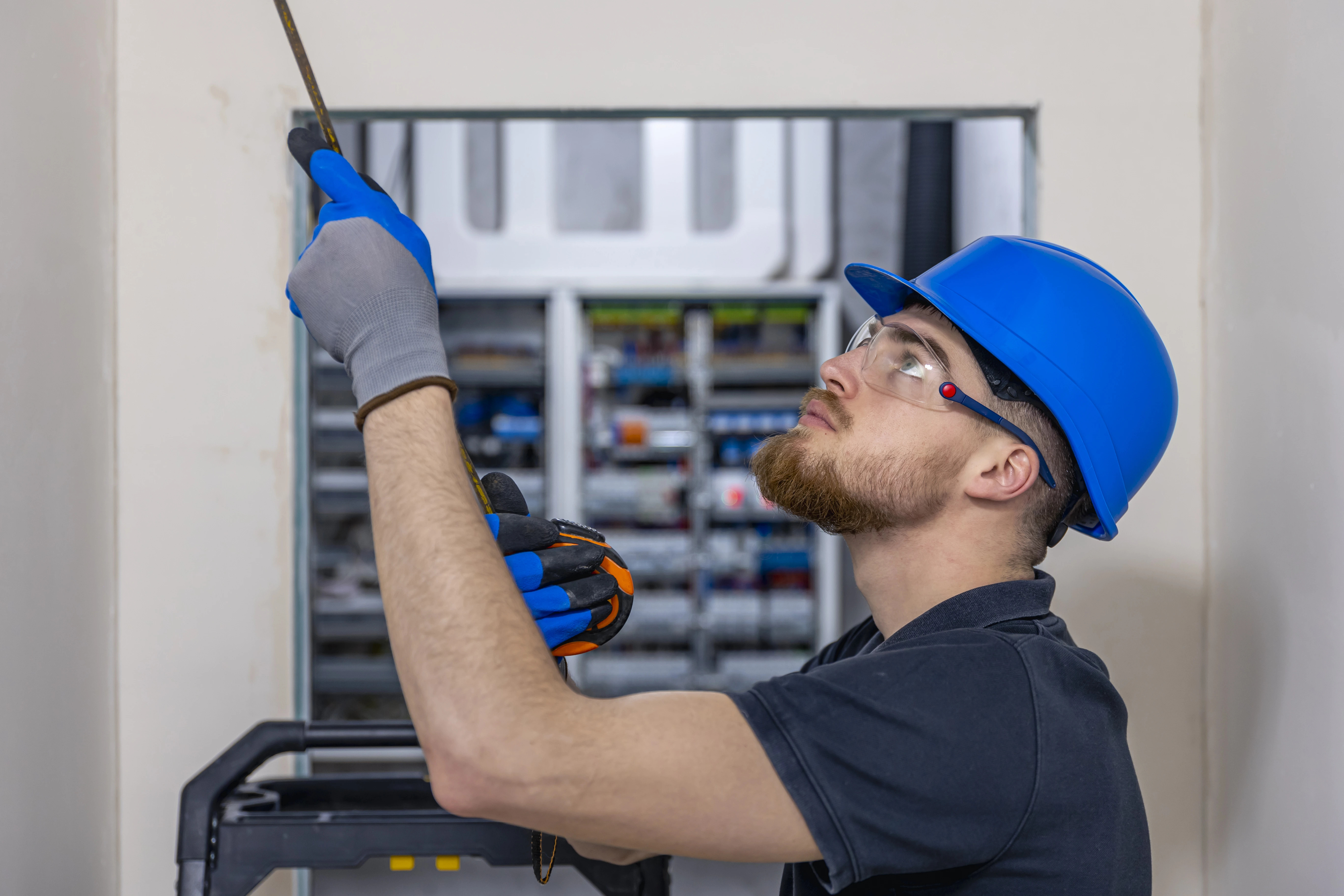 Technician handling elevator spare parts